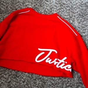 A cropped jacket or sweater
